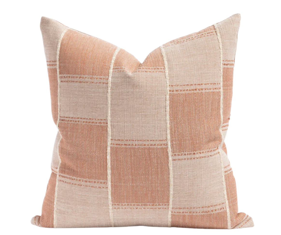 pillow has a chunky vertical stripe and tone-on-tone terracotta pattern