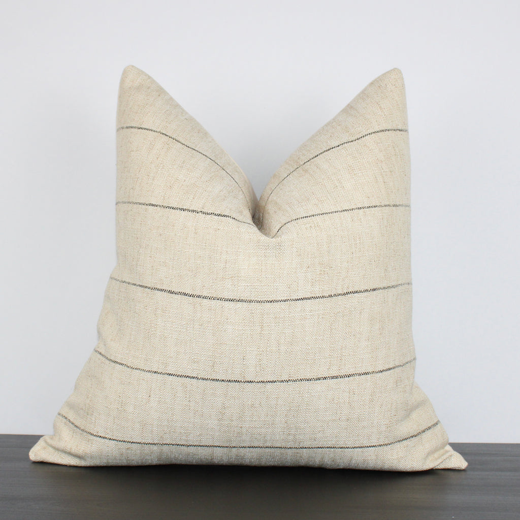 This fabric is absolutely wonderful! It has a thin, woven black stripe on a slubby, sand-colored background, giving it an organic quality that suits a variety of spaces, from modern to traditional.
